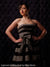 High-end black photography backdrop with detailed tufting.