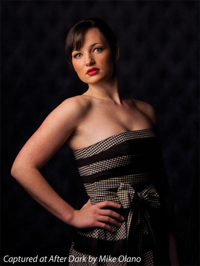 Black tufted studio backdrop offering depth and texture for headshots.