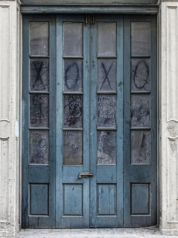 Blue Weathered Door Photography Backdrop - Weathered blue door photography backdrop with distressed glass panels for moody, urban-themed photoshoots.