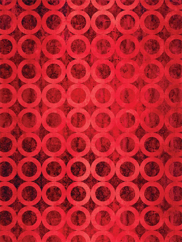 Bold red photography backdrop with a repeating circle pattern, ideal for professional and creative portrait sessions.