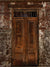 Rustic photography backdrop featuring a weathered wooden door set in a textured brick wall, ideal for vintage, urban-themed photo shoots.