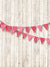 pink pennant on white wall valentine portrait backdrop