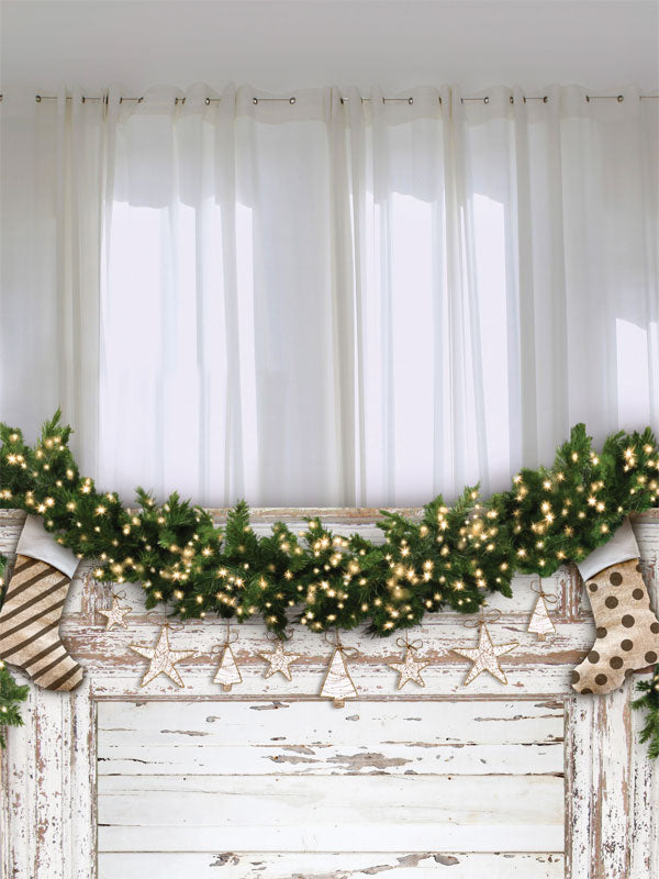 Christmas Stocking and Garland Photography Backdrop - A Christmas-themed photography backdrop featuring a whitewashed wooden mantle decorated with a festive garland, twinkling lights, and hanging stockings.