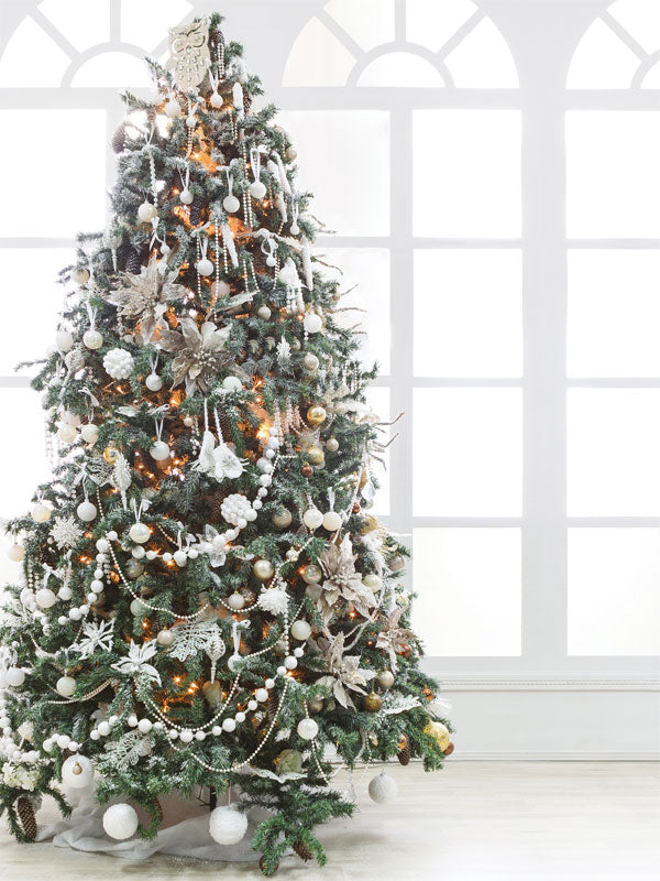 Christmas Tree in Classic Room Photography Backdrop - A tall Christmas tree decorated with white and silver ornaments, set against large arched windows, perfect for holiday photoshoots.