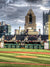 City Baseball Stadium Photography Backdrop - A vibrant baseball stadium with a green field, seating, advertisements, and a city skyline in the background.