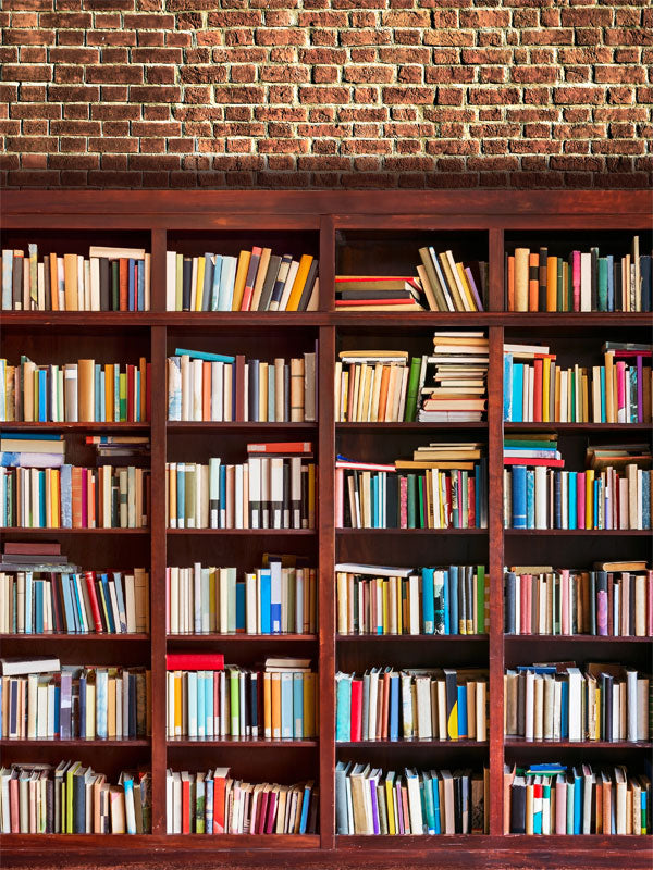 Classic Bookshelf and Brick Wall Photography Backdrop - Bookshelf filled with colorful books against a red brick wall, creating a cozy, intellectual photography backdrop perfect for portraits and lifestyle shoots.