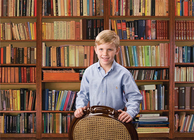 Full library wall scene ideal for academic or editorial portrait setups.