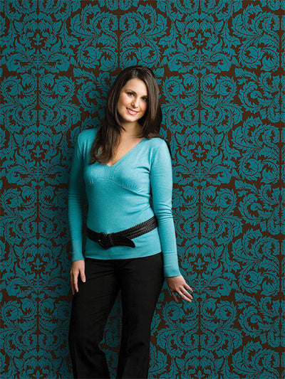 Ornate vintage damask design with bold teal-on-brown contrast.