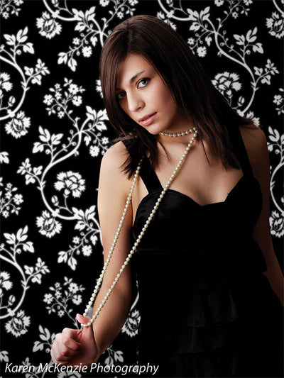 Detailed white botanical design on black with timeless styling.