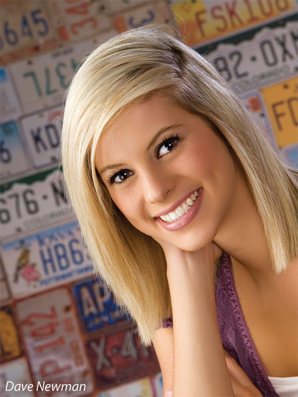 Backdrop featuring a patchwork of collectible car plates in bold tones.