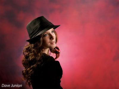 Vivid photography backdrop featuring layered reds, orange heat, and burned texture.