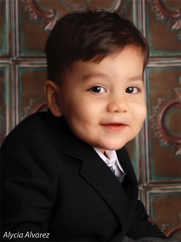 Embossed backdrop offering sharp texture and tonal dimension.