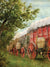 Covered Wagon Trail Photography Backdrop - Covered wagon trail photography backdrop featuring red and wooden wagons under trees, ideal for vintage, western, and rustic-themed photoshoots.