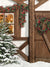 Cozy Christmas Cottage Photography Backdrop - Photography backdrop featuring a snow-covered Christmas cottage with a warmly lit window, holiday decorations, and a wooden door with a wreath.