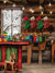 Cozy Christmas Santa’s Workshop Photography Backdrop - Photography backdrop featuring a cozy Christmas workshop with rustic wooden elements, holiday decorations, a string of glowing bulbs, a snowy window, colorful toys, paintbrushes, and a wooden rocking horse, creating a festive, wintery scene.