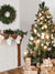 Cozy Christmas Tree and Fireplace Photography Backdrop - Christmas tree and rustic fireplace backdrop featuring holiday decorations, stockings, and presents for cozy holiday photoshoots.