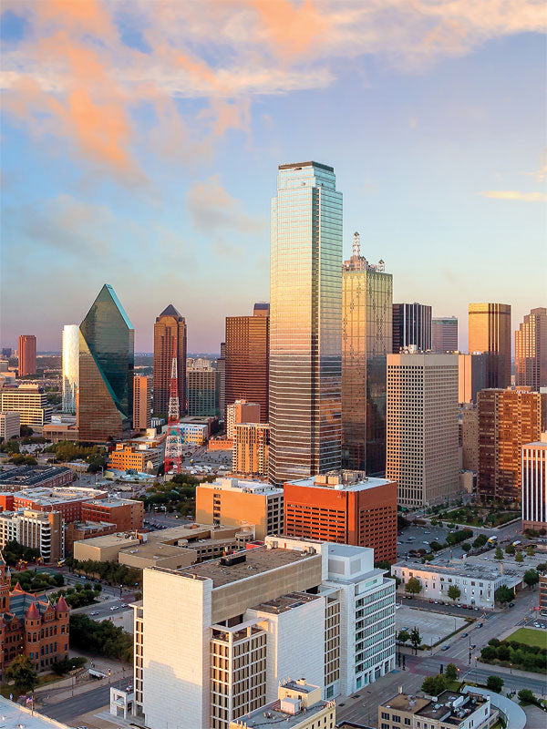 Dallas Skyline at Sunrise Photography Backdrop - Dallas skyline photography backdrop featuring sunrise with warm hues of orange, pink, and blue. Perfect for urban-themed photoshoots.