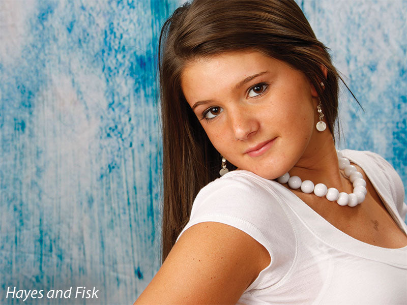 Subtly worn surface with faded blues and greys for moody portraits.