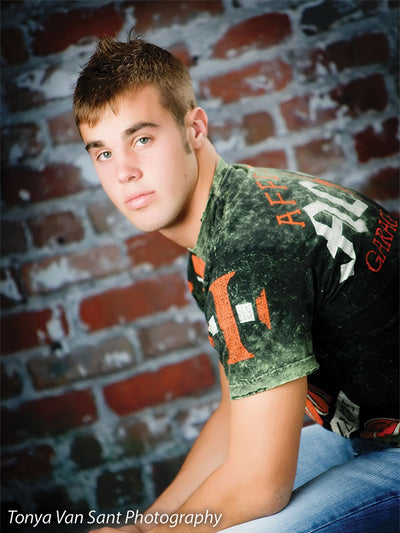 Rugged distressed brick photography backdrop with natural aging.