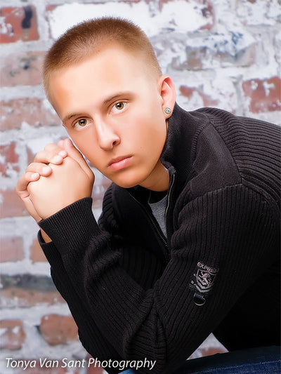 Textured brick wall backdrop perfect for creative portraits.