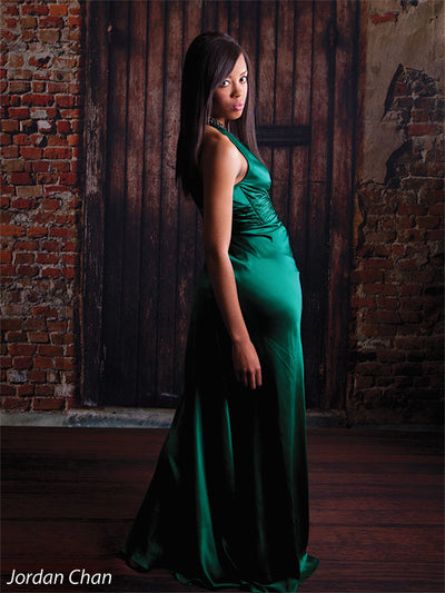 Distressed brick wall backdrop for urban-themed portraits.