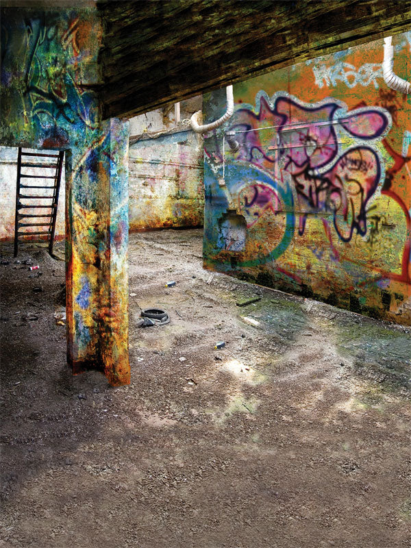 Graffiti-covered basement with colorful tags and exposed beams for street-style shoots.