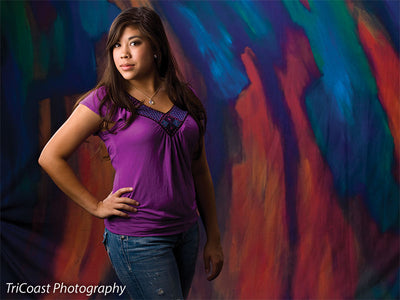 Backdrop with abstract brush marks in overlapping colors for depth and texture.
