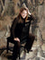 A modern photography backdrop with a textured, geometric design in muted camo-style browns and grays.
