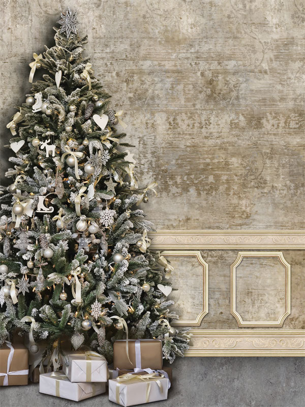Elegant Christmas Tree with Vintage Wall Photography Backdrop - An elegant Christmas tree with silver and gold decorations placed beside a vintage wall, perfect for festive photography backdrops.