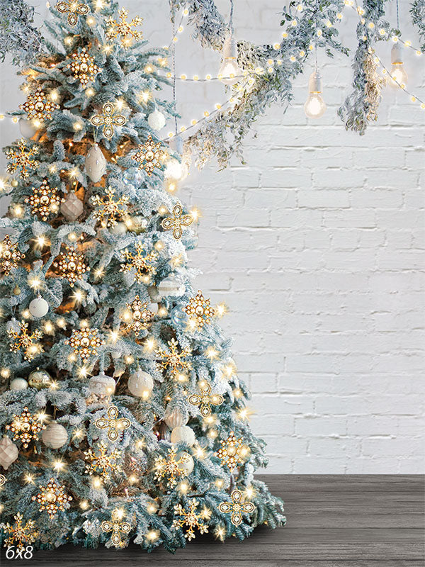 Elegant Frosted Christmas Tree Photography Backdrop - A frosted Christmas tree decorated with shimmering lights and snowflake ornaments, set against a white brick wall, perfect for holiday photography.