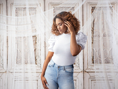 Elegant vintage wooden door backdrop showcasing distressed white doors with decorative wrought iron accents, creating a timeless and classic photography setting.