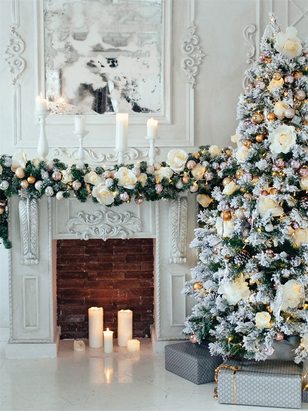 Elegant White Christmas Fireplace and Tree Photography Backdrop - Elegant white Christmas tree and fireplace backdrop with golden ornaments, flowers, and candles for sophisticated holiday photography.