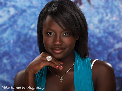 Ornate design in rich blue and plum tones for portrait or editorial photography.
