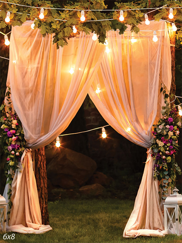 Enchanted Garden Wedding Photography Backdrop - Romantic outdoor garden scene with draped curtains and string lights for evening wedding photography.