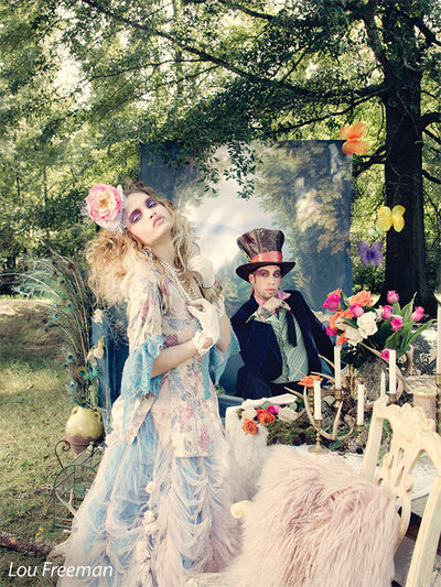 Princess forest themed backdrop being used outdoors with Alice and Wonderland themed photoshoot