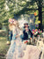 Princess forest themed backdrop being used outdoors with Alice and Wonderland themed photoshoot