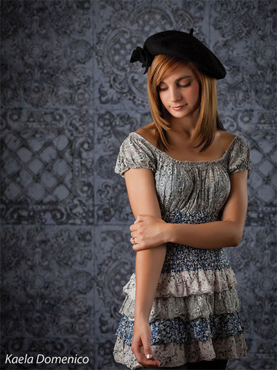 Neutral gray tile backdrop for editorial shoots.