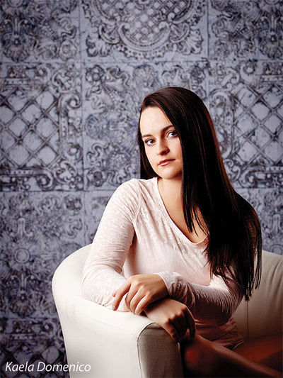 Vintage-style gray studio photography backdrop.