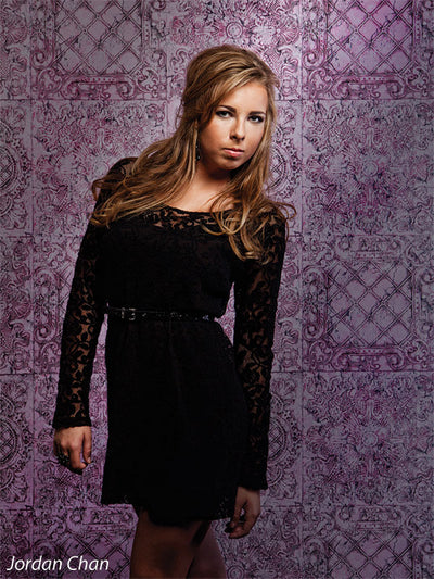 Distressed pink vintage backdrop for sophisticated shoots.