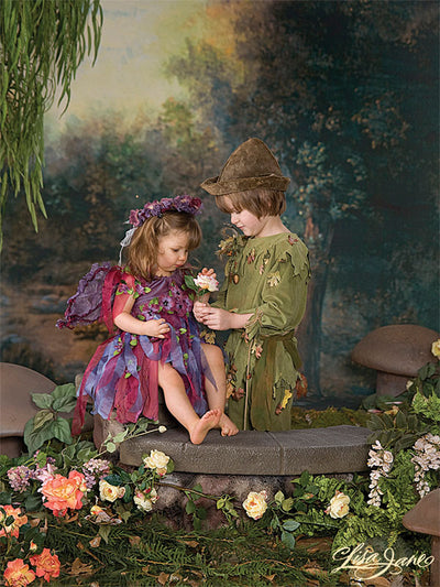 A charming backdrop with lush trees, glowing highlights, and a hidden fairy-tale-like woodland path.