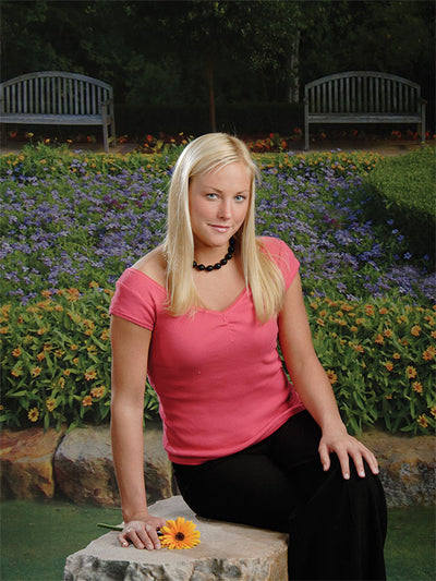 Formal garden scene with blooming flowers and structured greenery layout.