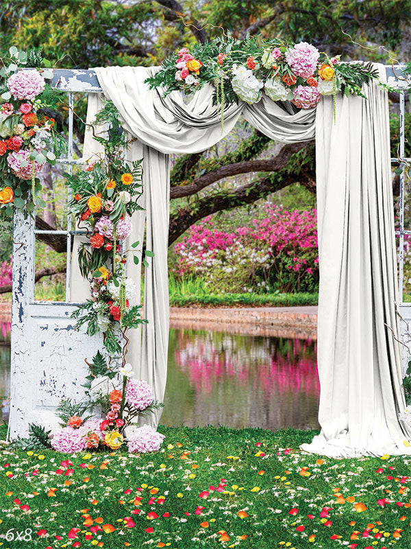 Floral Garden Ceremony by the Pond - Photography backdrop featuring a garden arch with flowers and drapery beside a pond, perfect for nature-themed photoshoots.