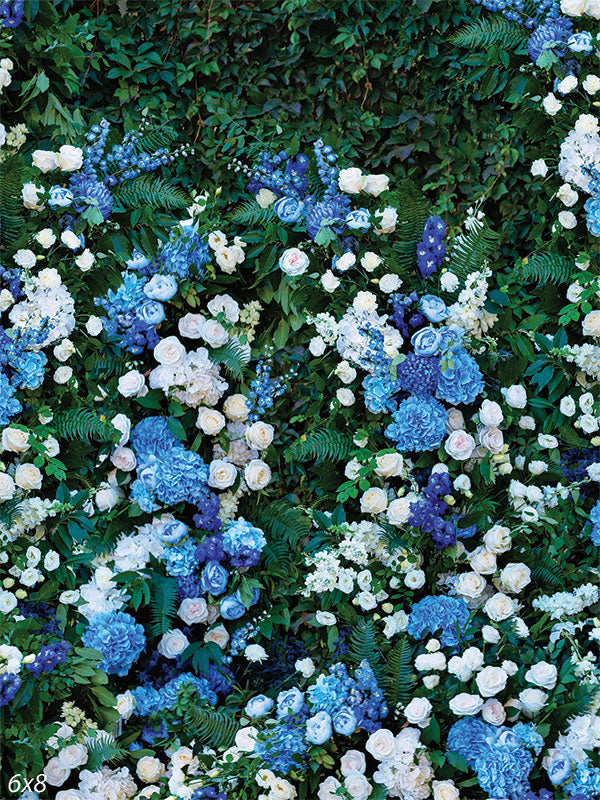 Floral Garden Photography Backdrop - Lush garden wall with blue and white flowers used as a photography backdrop.