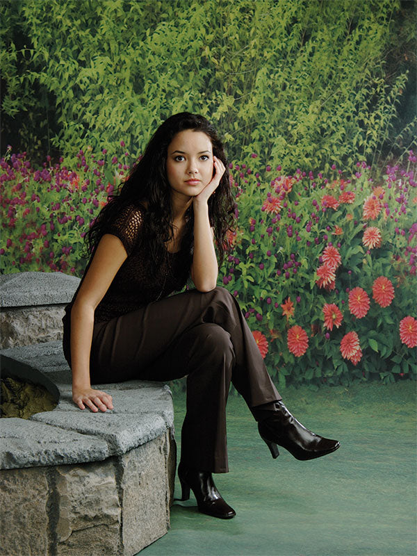 Vivid flower-lined garden backdrop for joyful, seasonal photography.