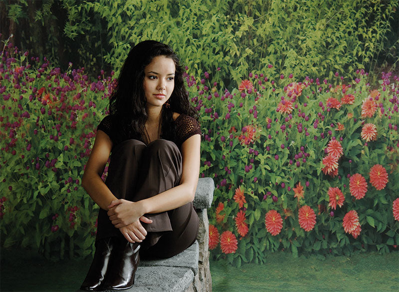Ideal spring studio background with bold floral row and dense hedge.
