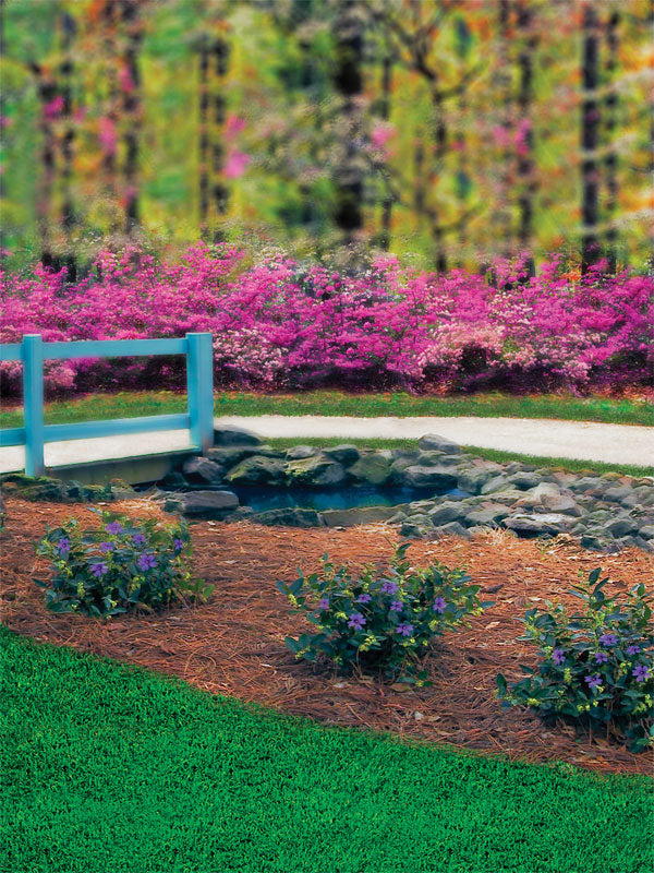 A scenic photography backdrop featuring a garden path, wooden bridge, and vibrant floral blooms, perfect for spring portraits and wedding photography.