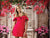 Classic French-inspired photography backdrop with a carved vintage door and vibrant floral accents, great for luxury branding and fashion photography.