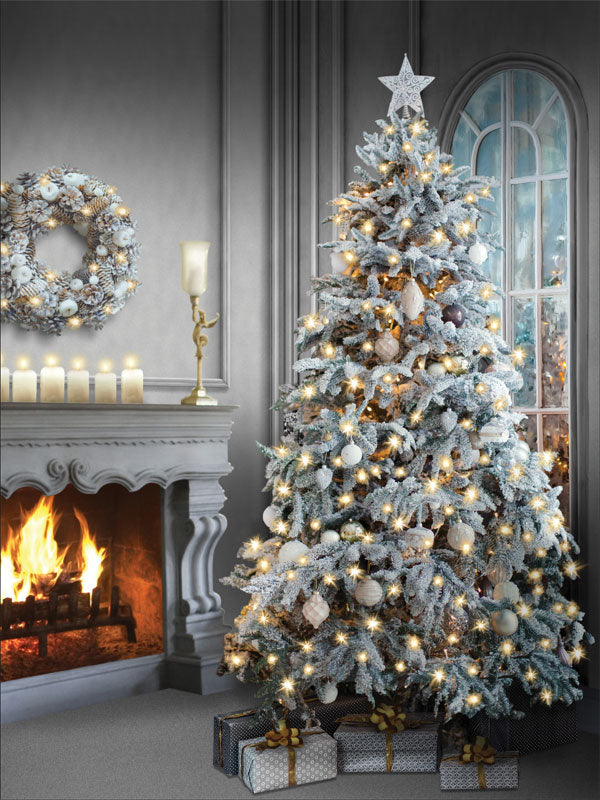 Frosted Holiday Fireplace with Christmas Tree Photography Backdrop - A cozy winter photography backdrop featuring a frosted Christmas tree next to a warm fireplace, perfect for holiday portraits.