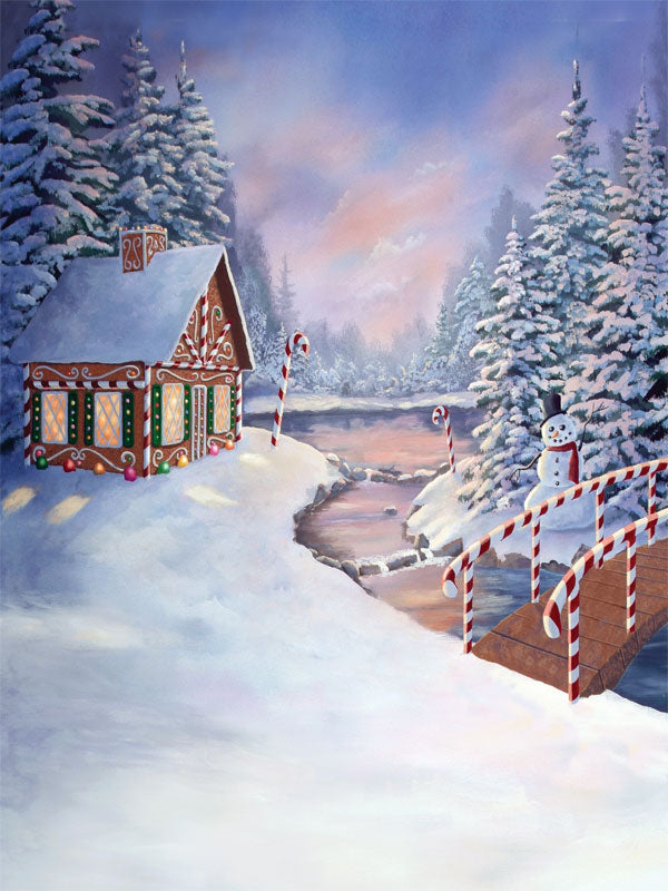 A snowy holiday backdrop with a whimsical gingerbread house surrounded by candy decorations and winter trees.