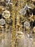 Golden Starry Christmas Photography Backdrop - Photography backdrop of golden stars, baubles, and twinkling lights creating a festive holiday ambiance.